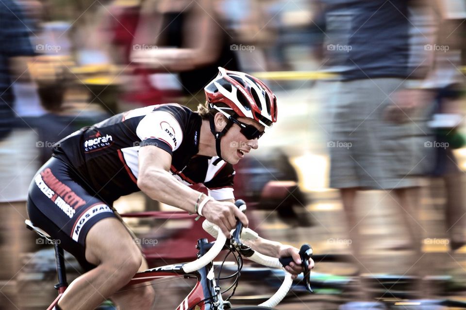 Cyclist racing his bike