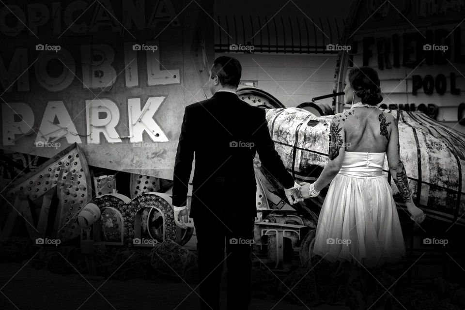 Wedding photo, Man and woman walking holding hands, leading nowhere, black and white wedding photography 