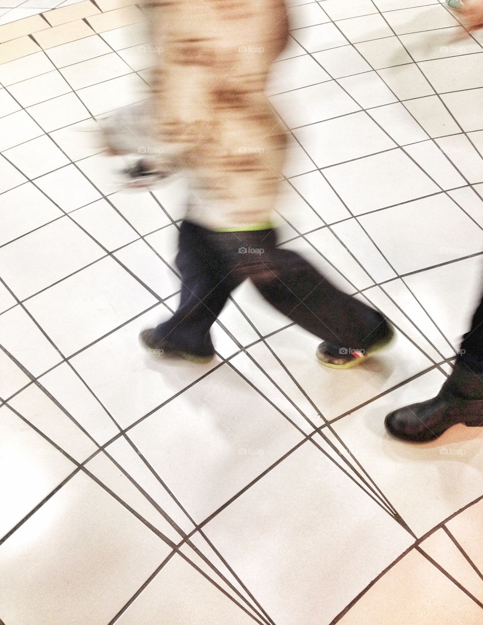 People Rushed, Motion Blur. 
Shoppers blurred as they are rushing, in a hurry at the mall