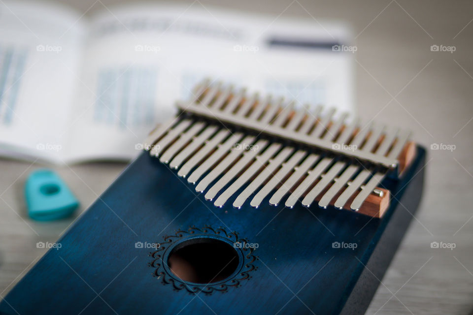 Blue kalimba and notes, close-up