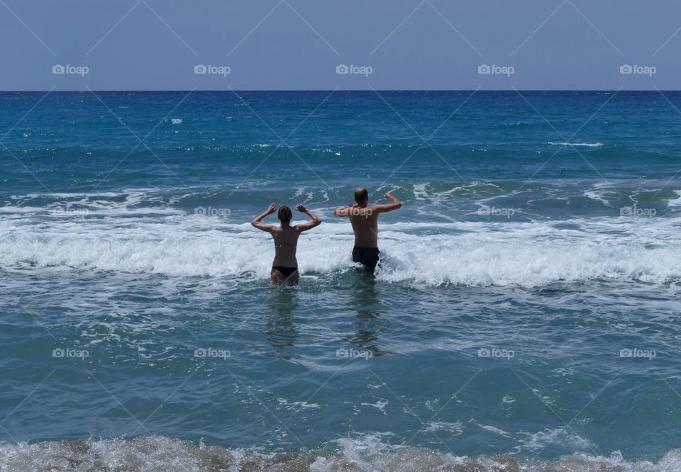 Couple bathing in the sea