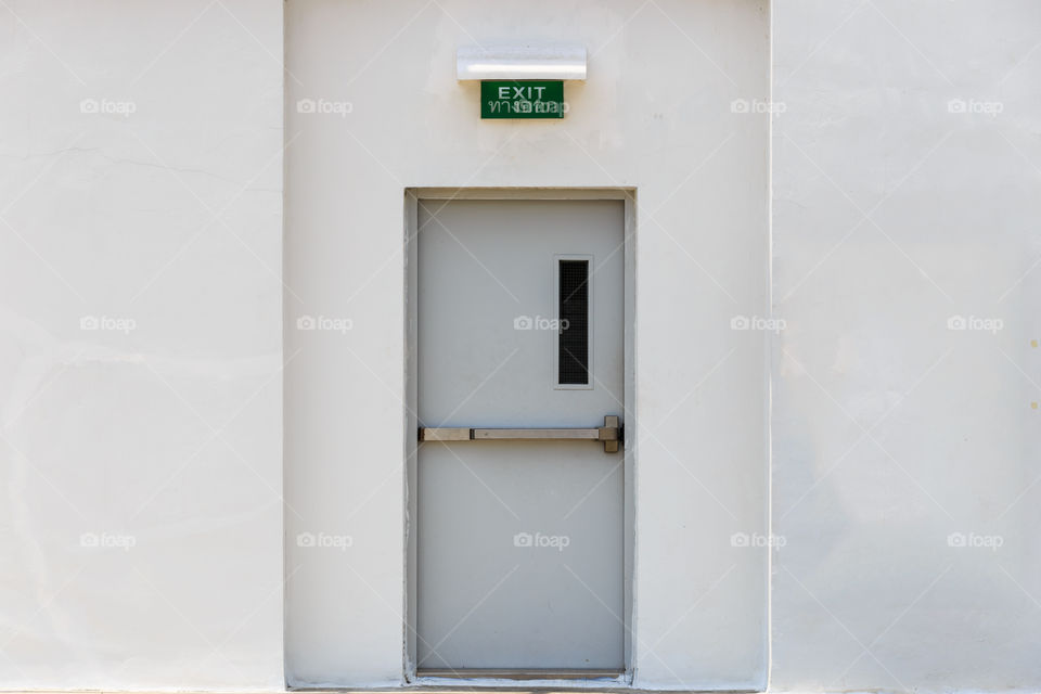 Exit door with white wall