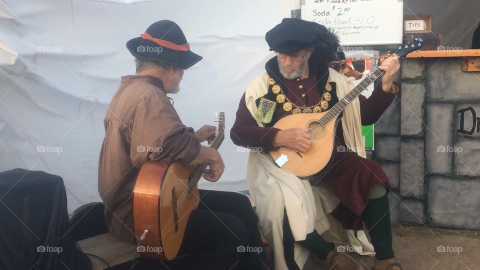  Guitarists in costume at the North Haven, CT, Renaissance Faire playing tunes from that time period.