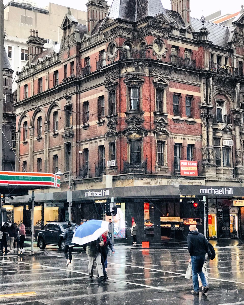 Walking in the rain in the city of Melbourne when it’s damp and a bit windy. 