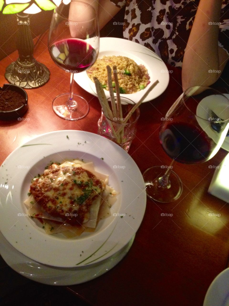 Dinner with lasagna, rice and wine