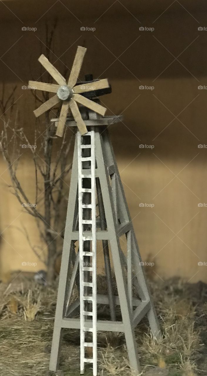 Wooden wind mill crafted by an expert. All pieces cut, painted and assembled by hand with great attention to detail. 