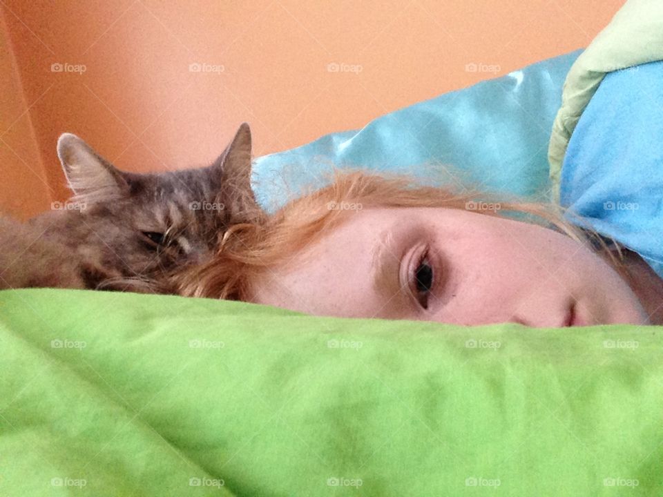 Never Waking. Serene photograph of a girl and cat waking up. 