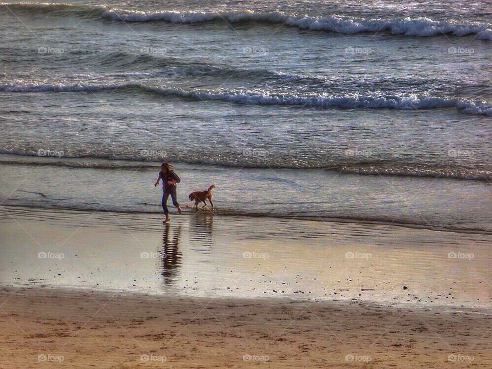 Girl and dog at play