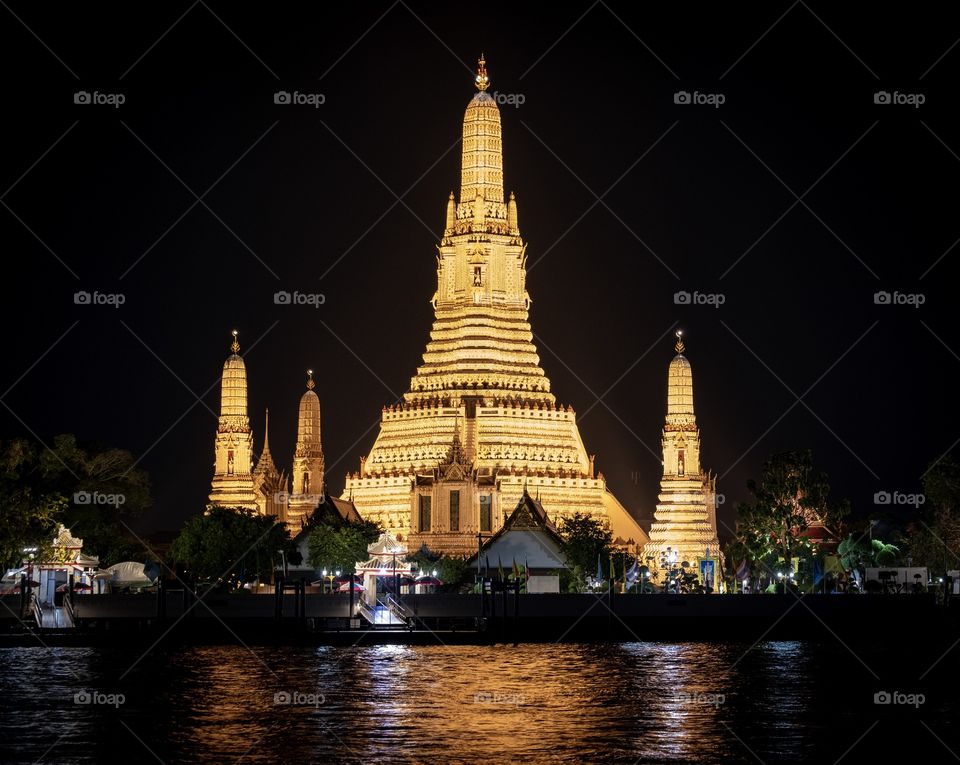 Bangkok/Thailand-The famous Beautiful night scene shot of monastery from Chao Phraya River ,it is wellknown  in English as the Temple of  Dawn. Once it was generally called Wat Chaeng that means "The Temple of  Dawn”