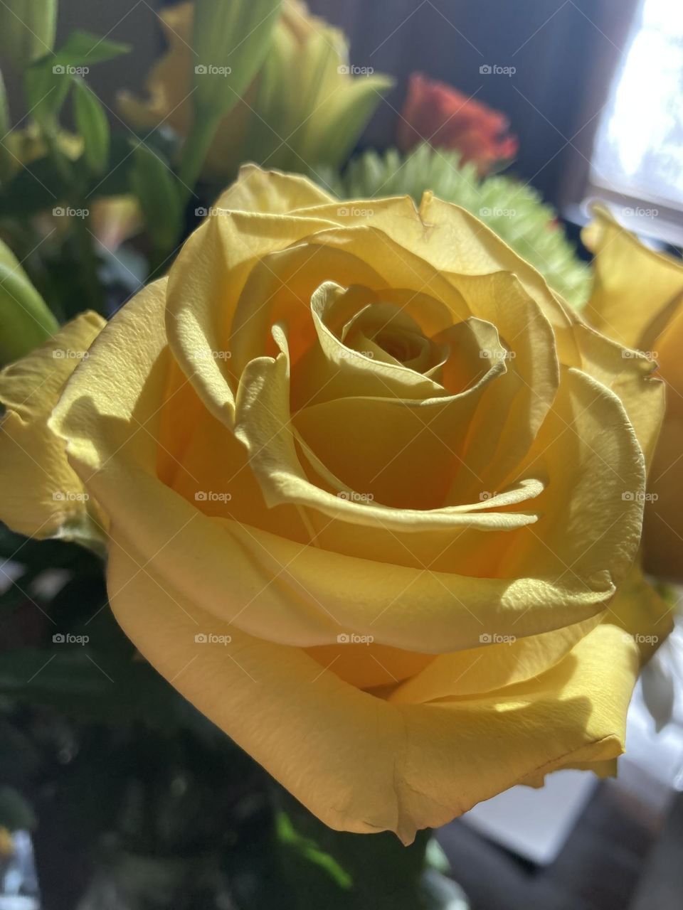 Yellow rose in a bouquet from my husband