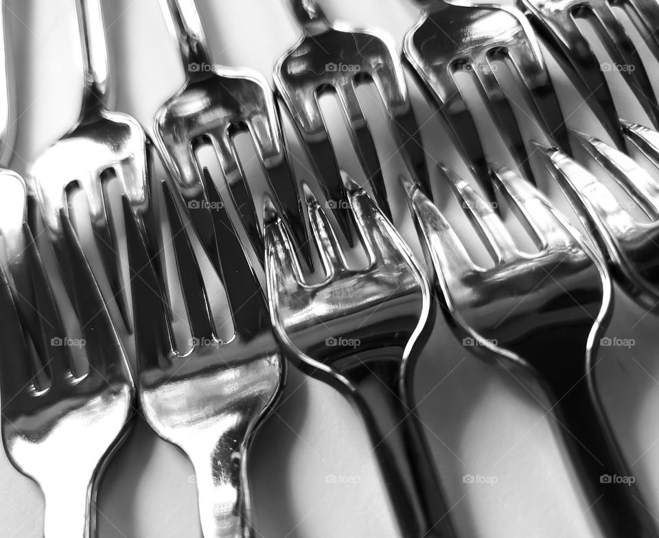 Fork abstract:  working together in black and white.