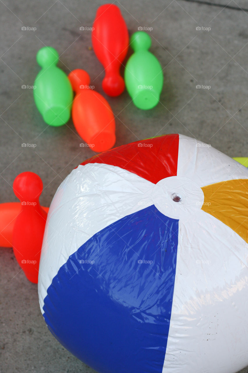 Plastic outdoor games equipment of bowling pins and an inflatable ball 