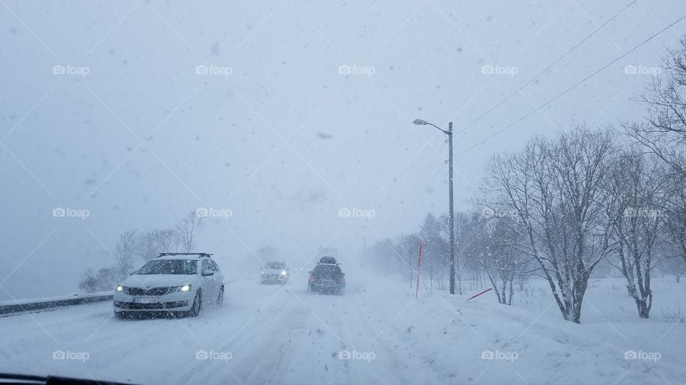 Driving in the snow blizzard