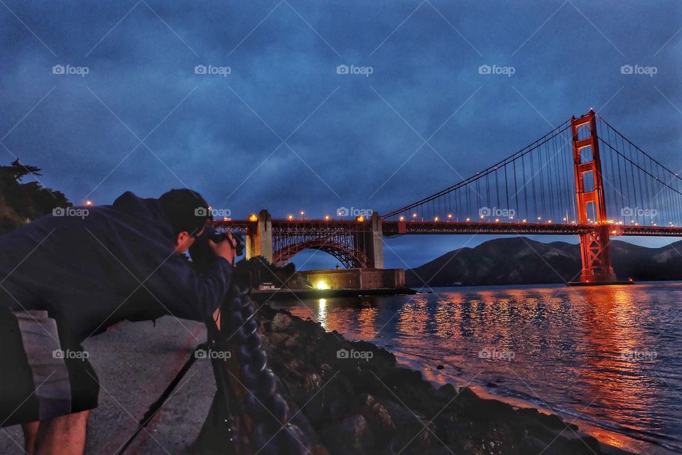 Professional photographer taking pics of the Golden Gate Bridge.