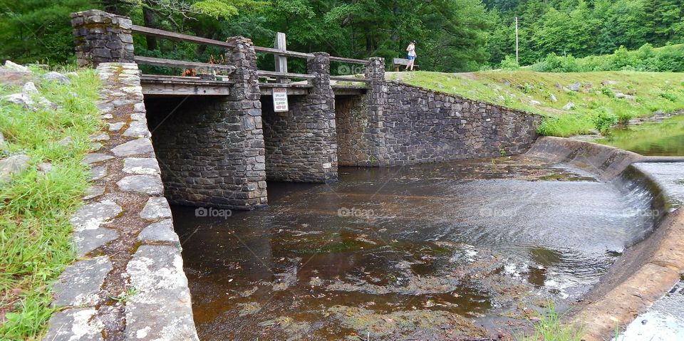 Bridge and spillway at lake in Vogel state park in Georgia