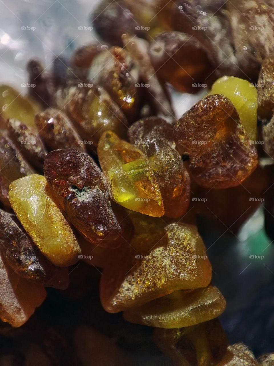 Macro photo of a natural amber stone lying on the table