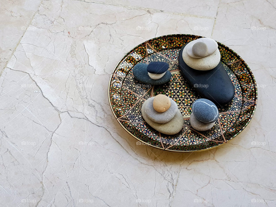 colourful pebbles arranged on a beautiful plate