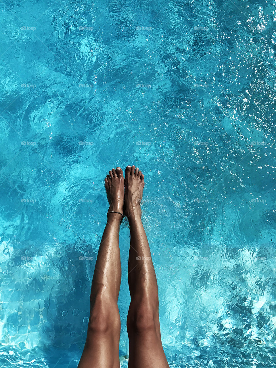 Legs in swimming pool 