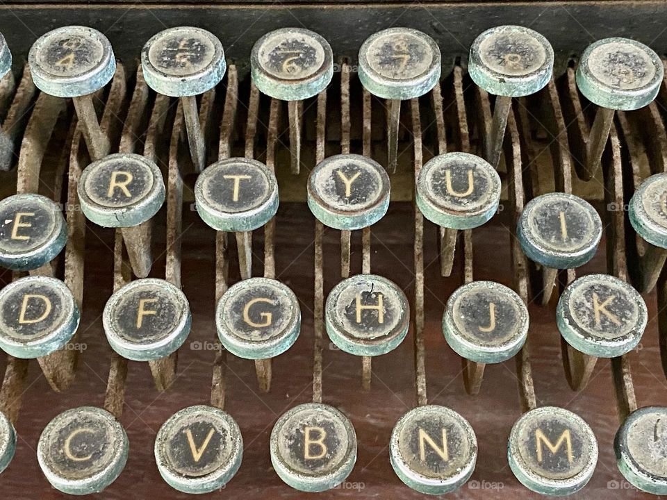 Round metal keys on an old typewriter 