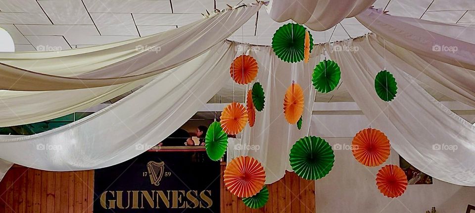 The sign saying “GUINESS” indicates that a “Gaelic Irish” event is taking place here at this concert hall in rural “Bavaria”, Germany. Festive decorations have been added to make this an evening to remember. 2023. Hypnotic Productions