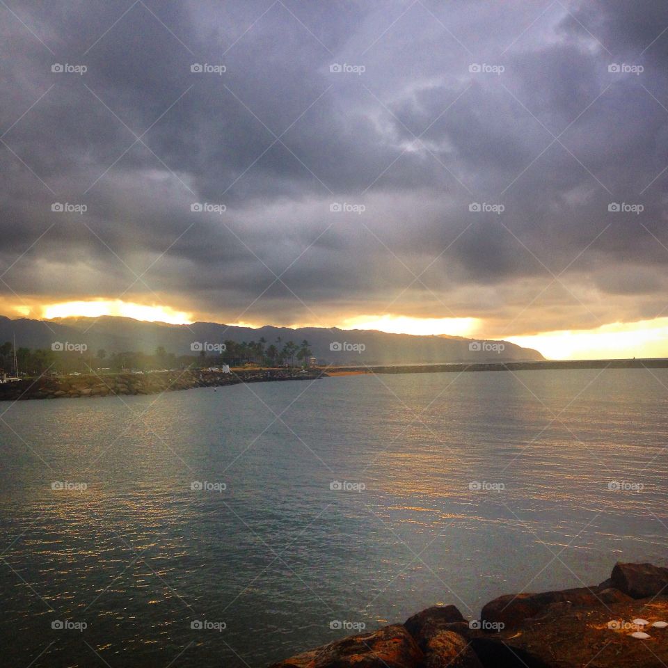 Saw the sunrays that was illuminating the ocean after the rain.