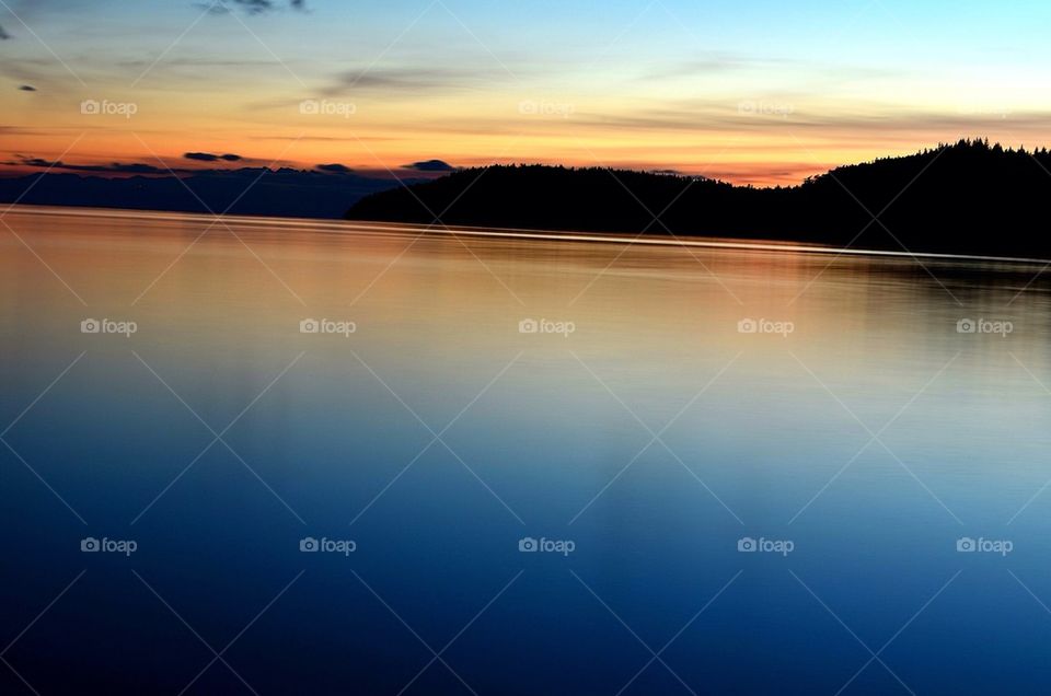 Dramatic sky reflected on sea