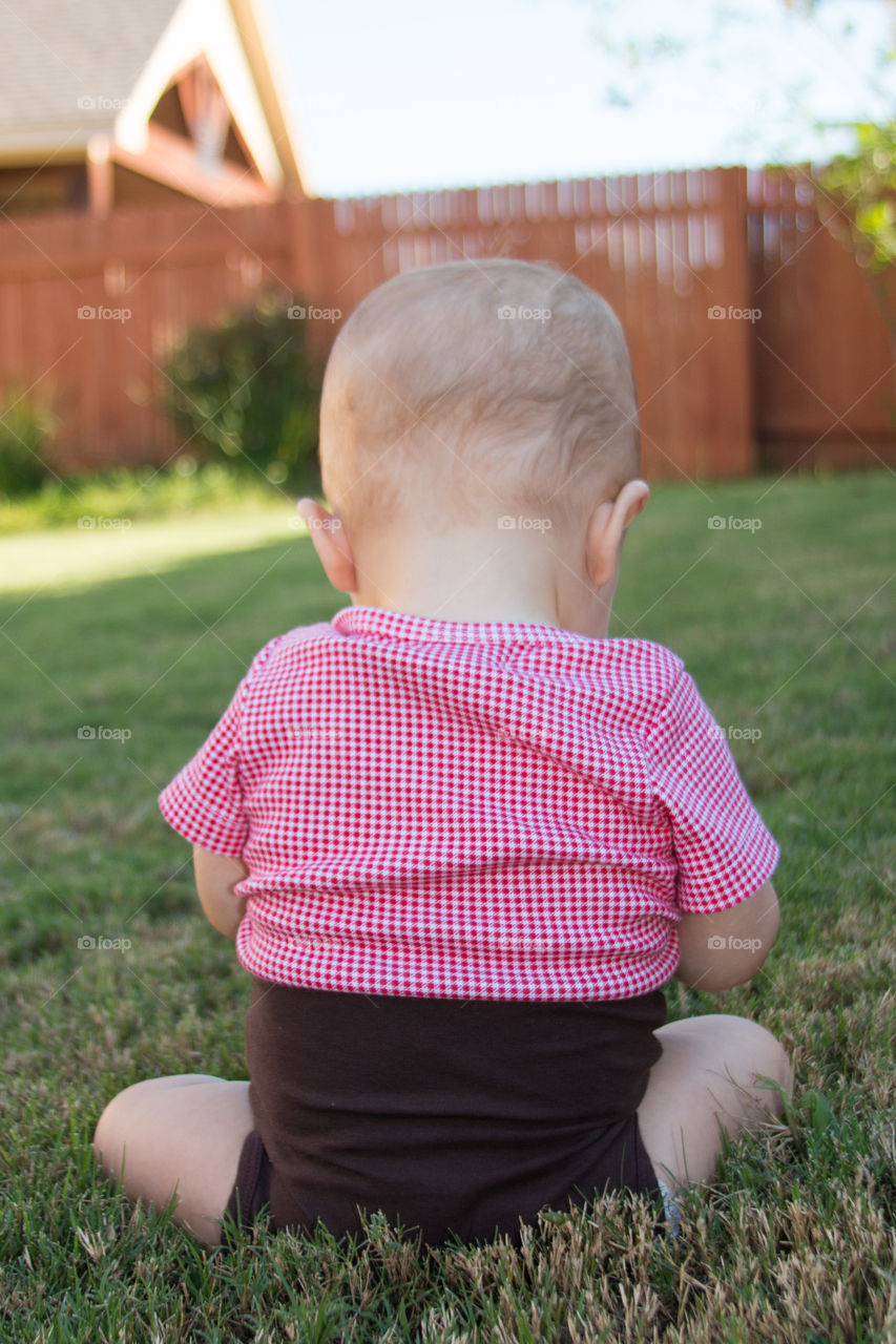 Baby playing in the grass