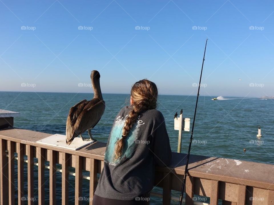 Fishing buddies watching the horizon 