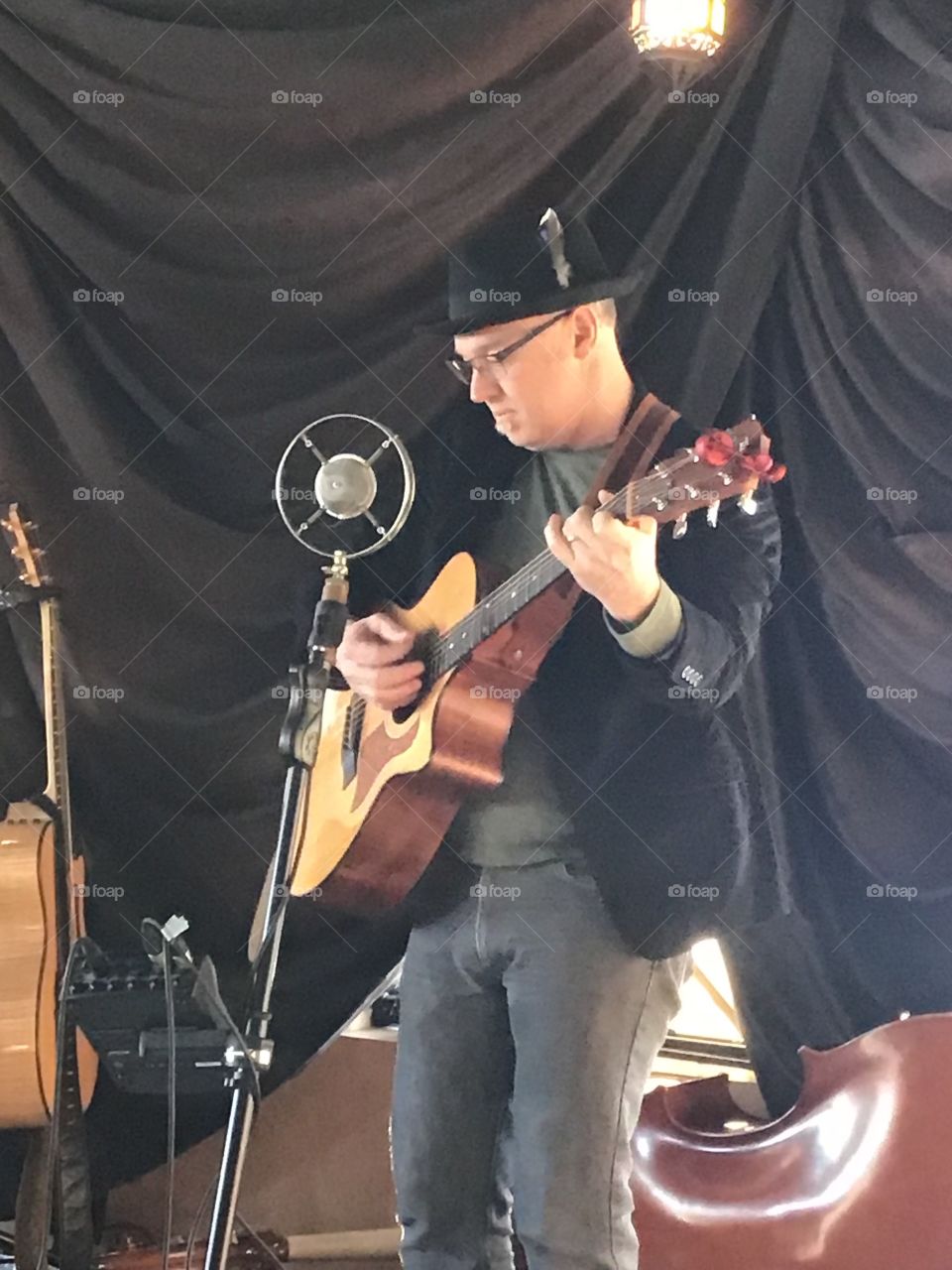 Playing guitar on stage 