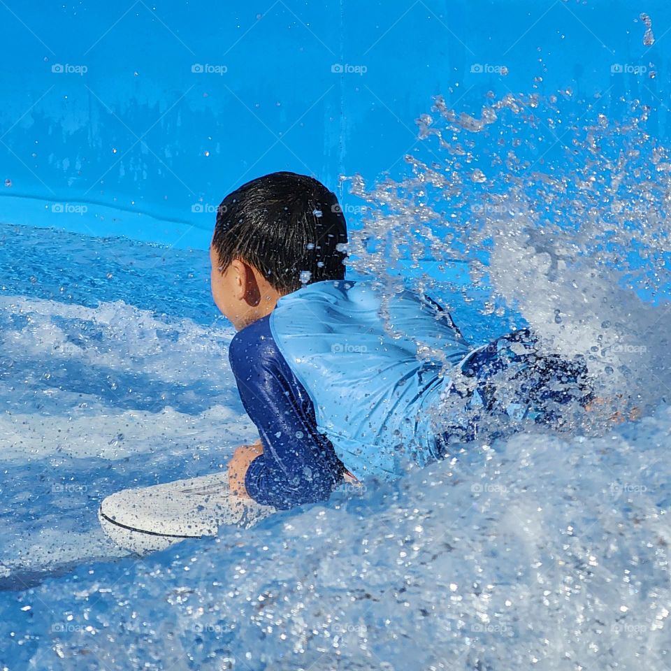 Little boy surfing🌊