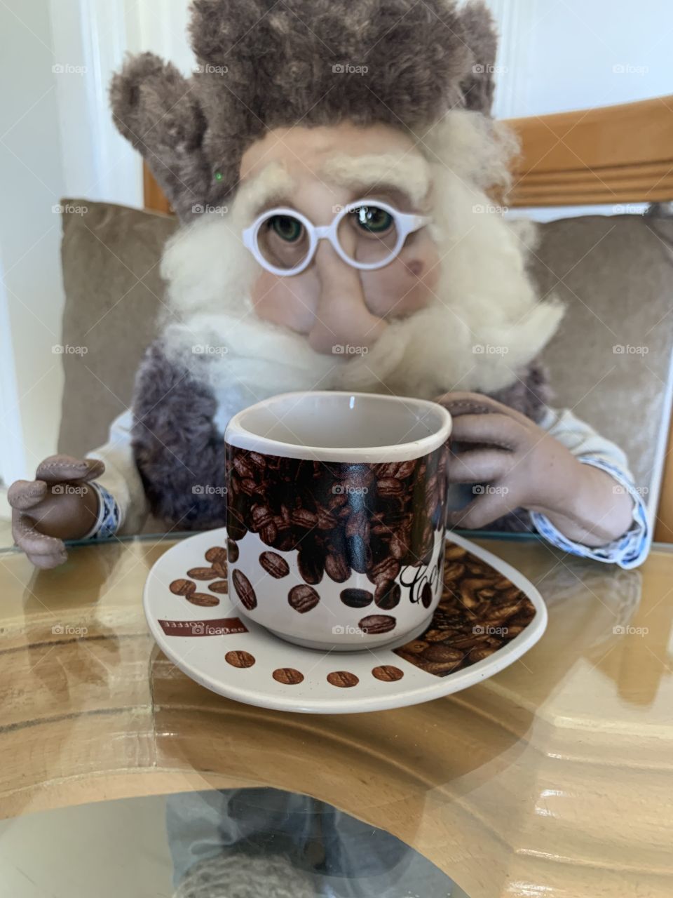 Doll drinking coffee