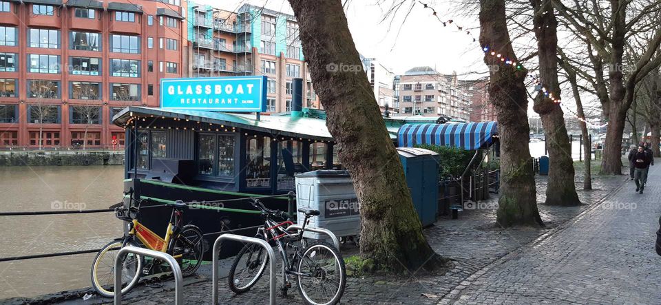 Bristol floating harbour with glass boat restaurant in view