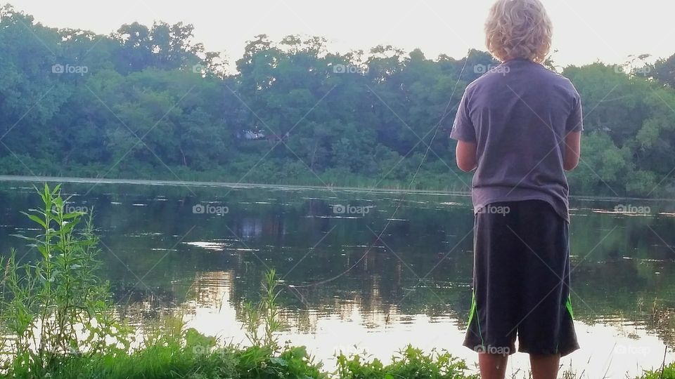 fishing boy sunset