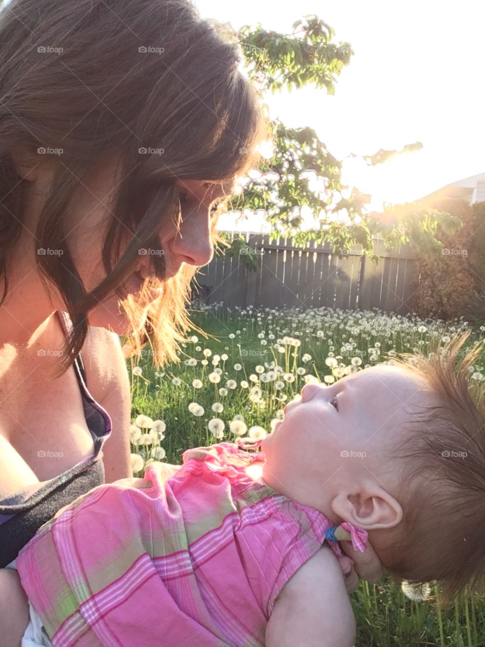 Mother and child in a field of dandelions