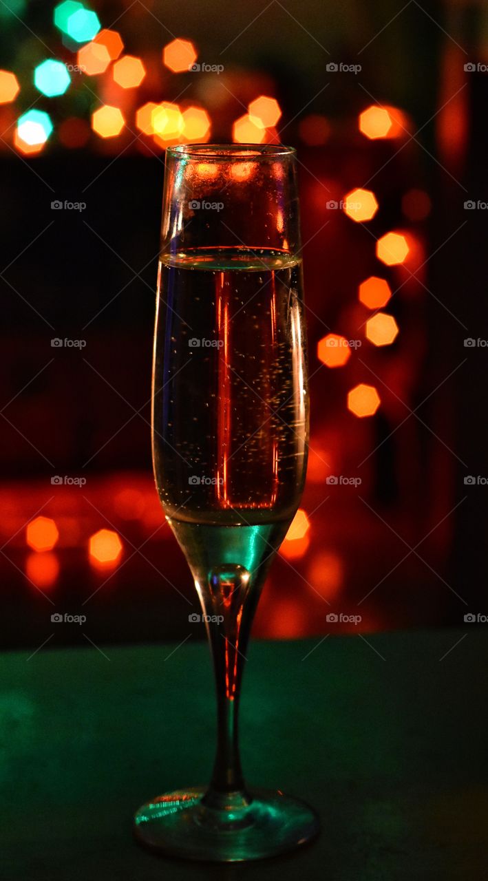 Glass of champagne on bokeh background during new years night in gdynia, poland