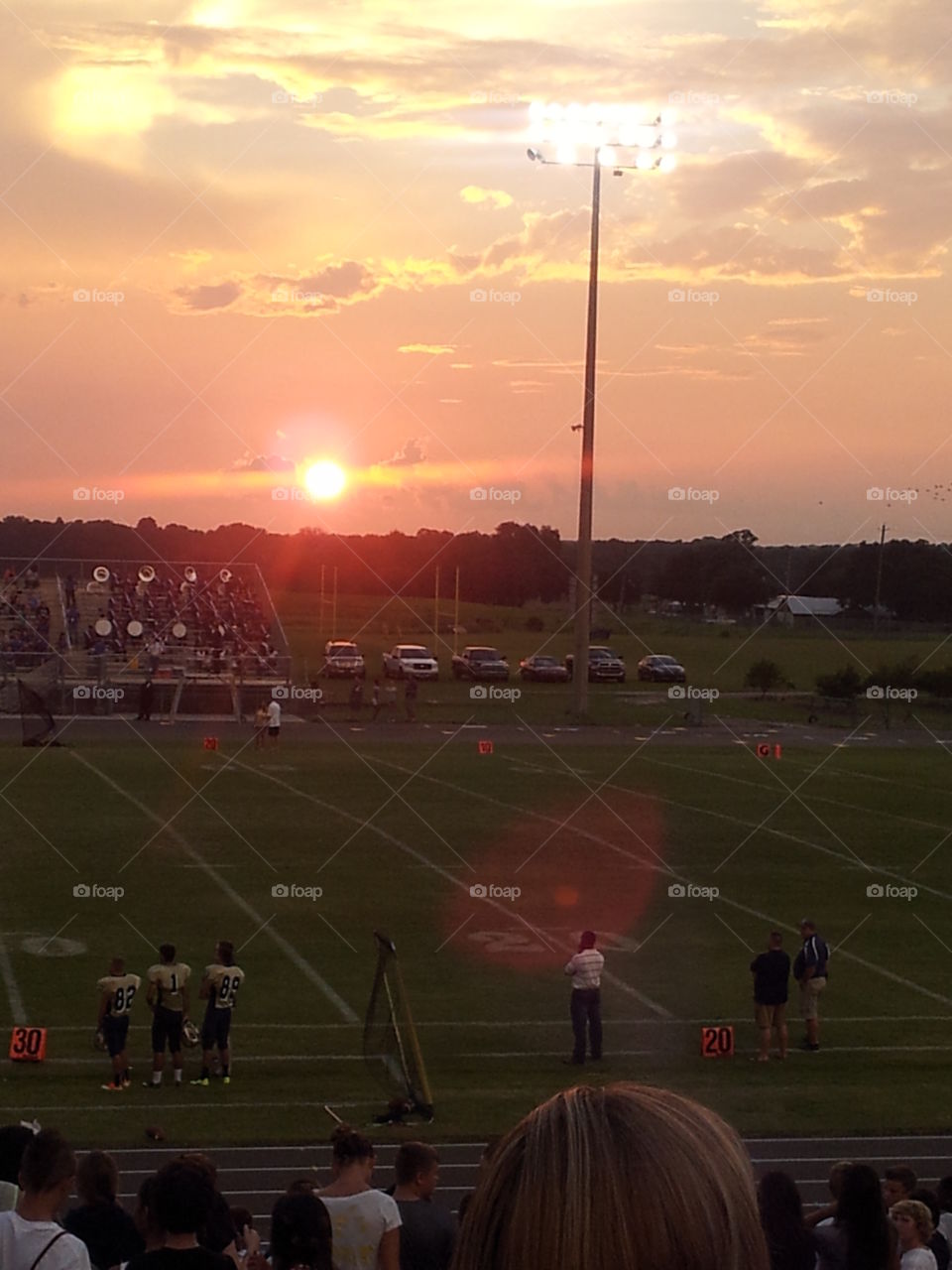 The perfect homecoming. Sunset on a highschool football game.