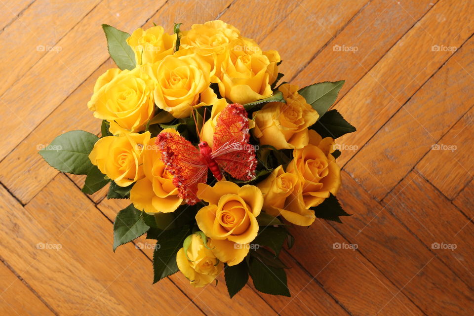 Yellow roses and butterfly