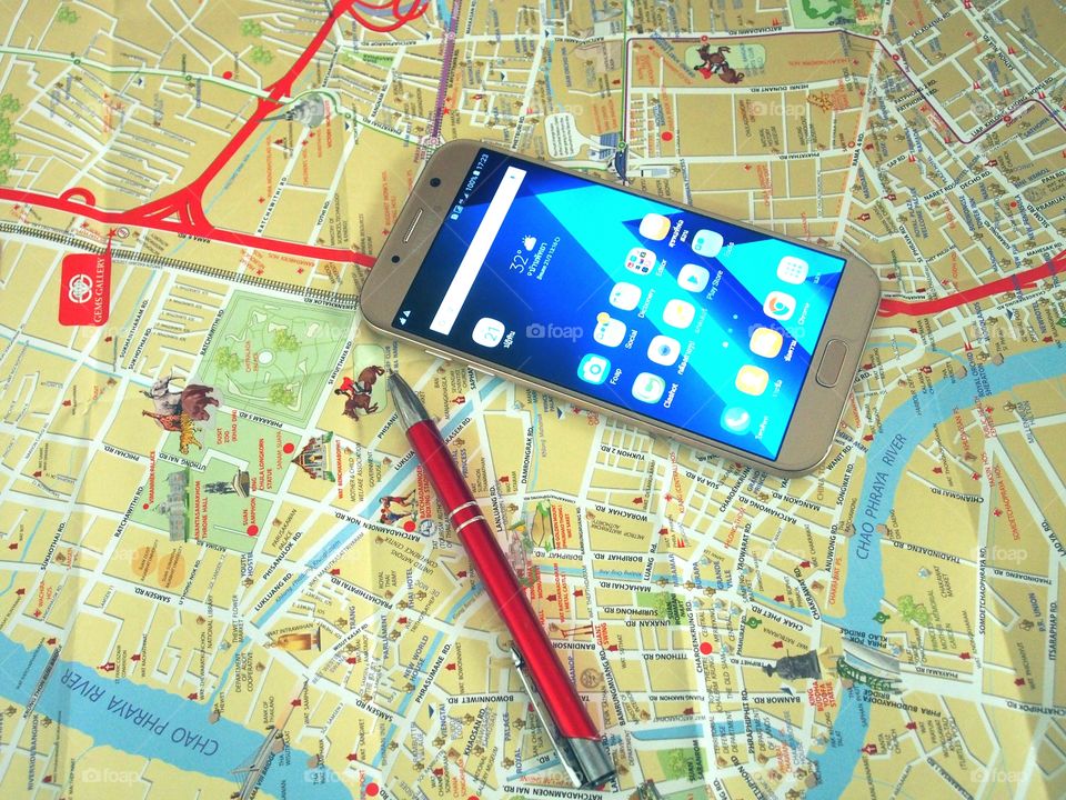 Pen,smartphone and travel map