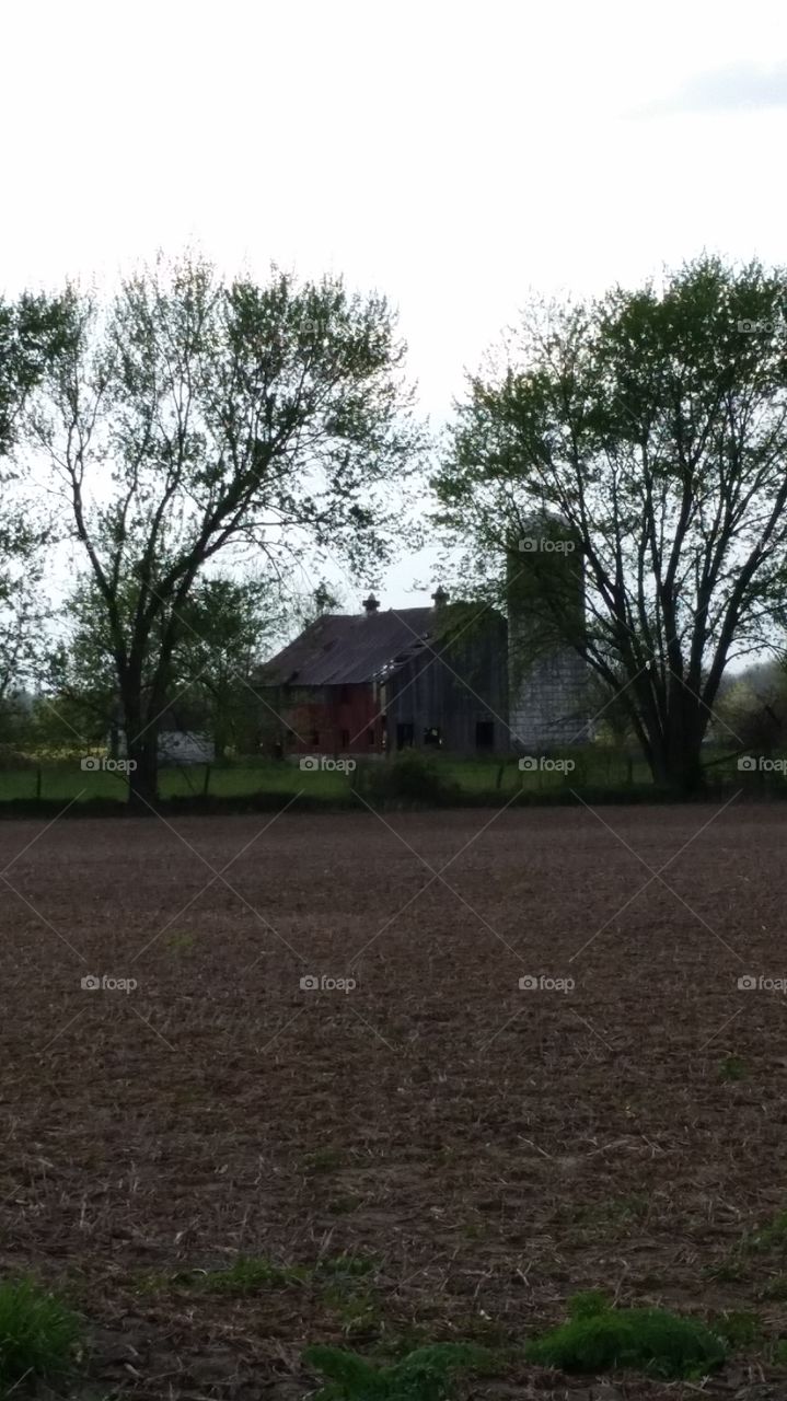 Barn in disrepair,  silo