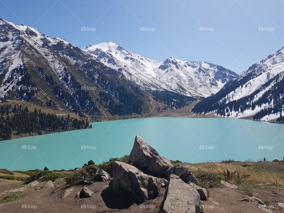 Turquoise lake in Alatau mountains in Kazakhstan