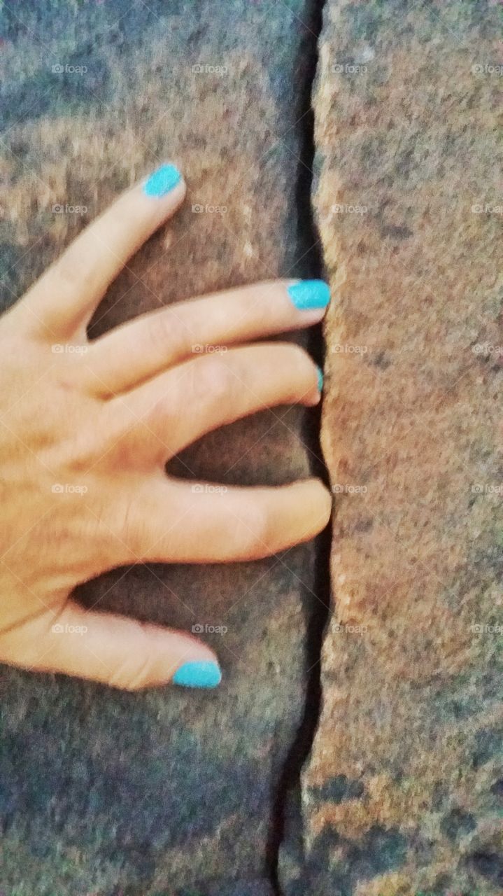 Feeling the natural carved stones, from the river that has helped mold them, for the last few hundred years. At Little River Falls, Fort Payne, Alabama