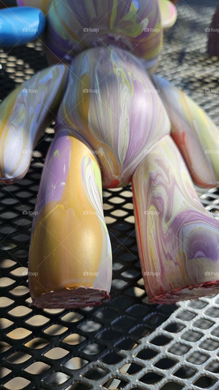 a pouring art toy bear