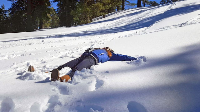 snow angel, girl enjoying the snow