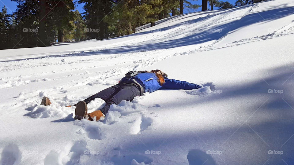 snow angel, girl enjoying the snow