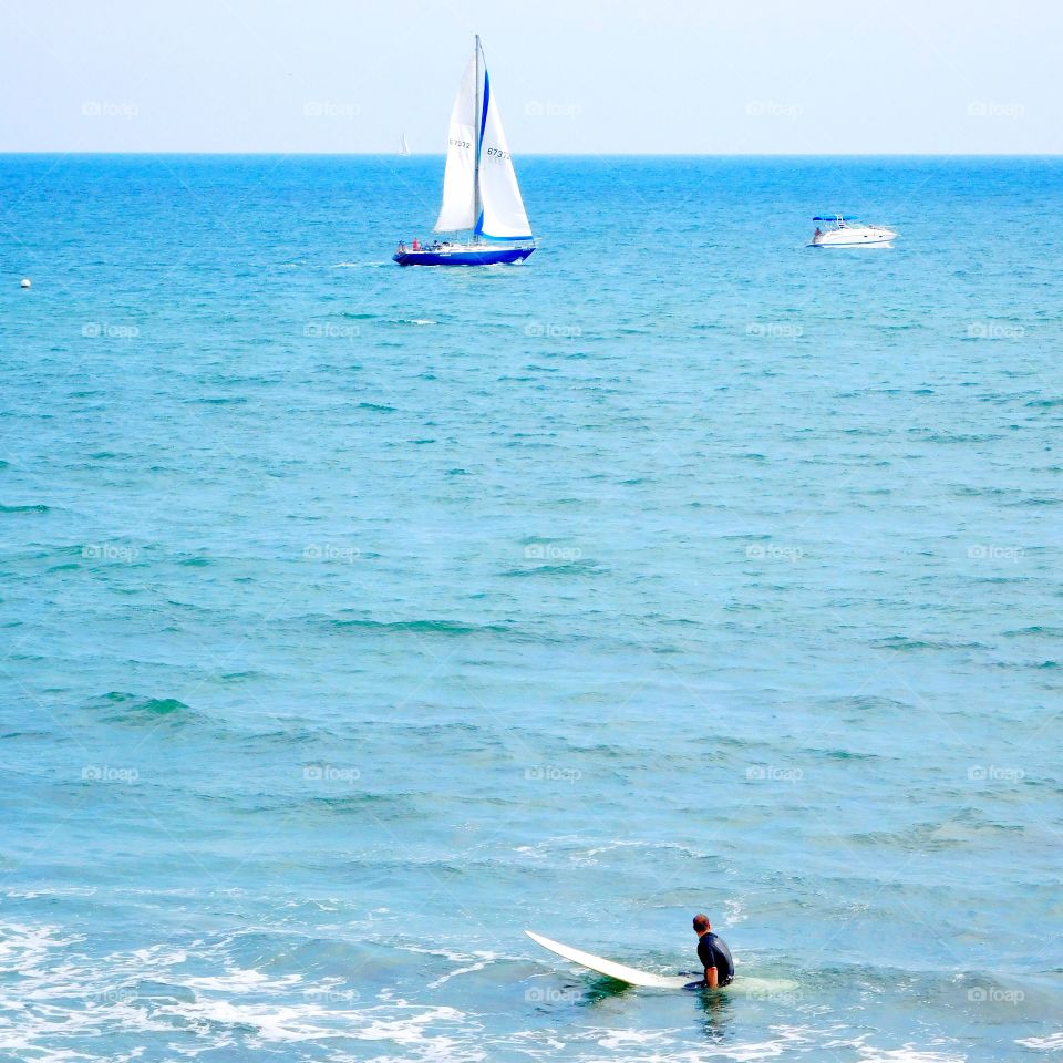 Awaiting a wave. Surfer waiting for a wave