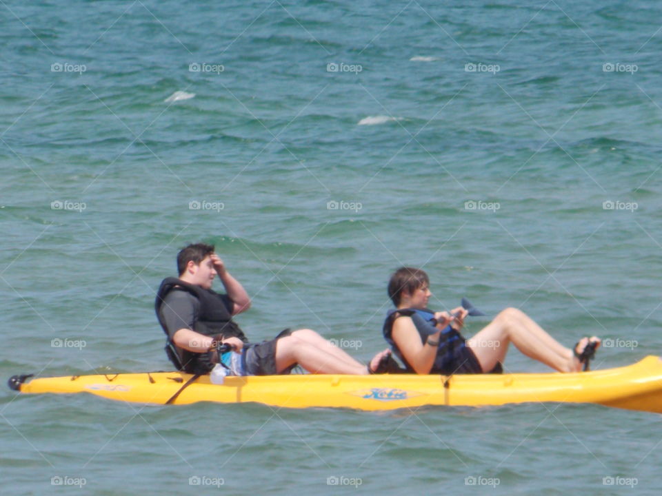 Two Man Pedal Kayak. The boys rowing with their feet on Lake Huron. 