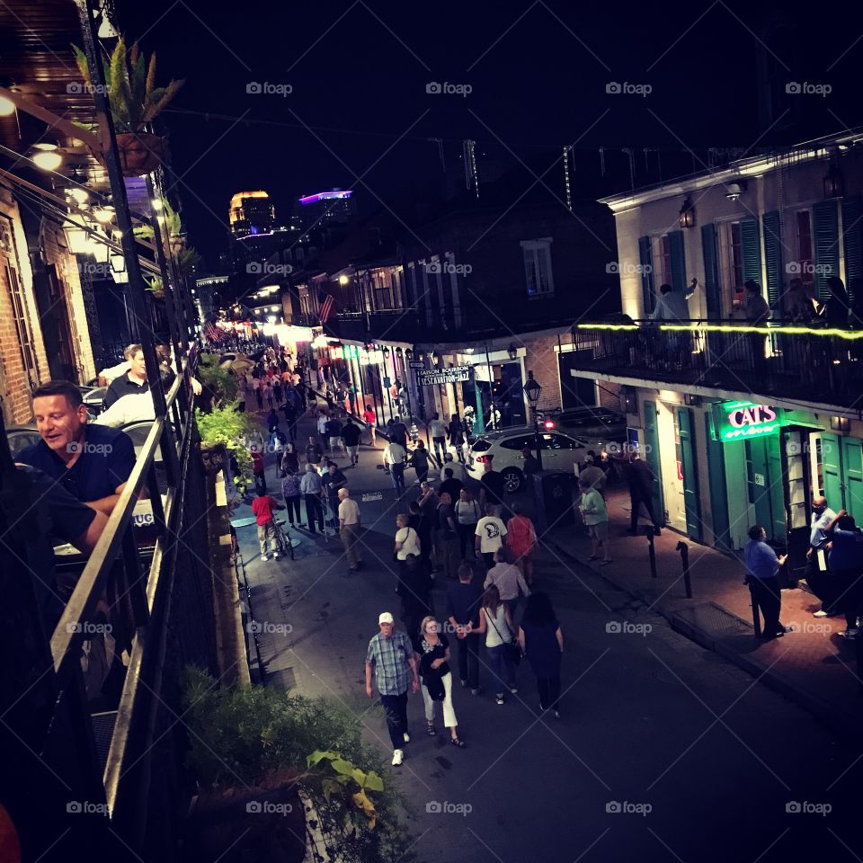 Scene from a porch above Bourbon Street in New Orleans, Louisiana.