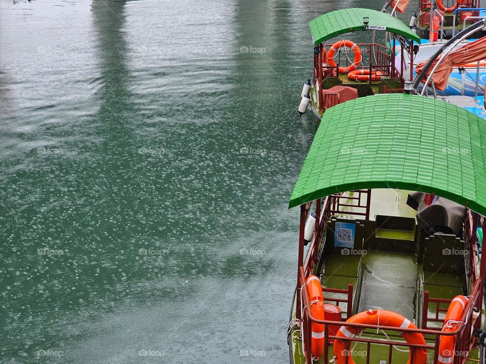 Parked walla walla boat at the typhoon shelter on a rainy day