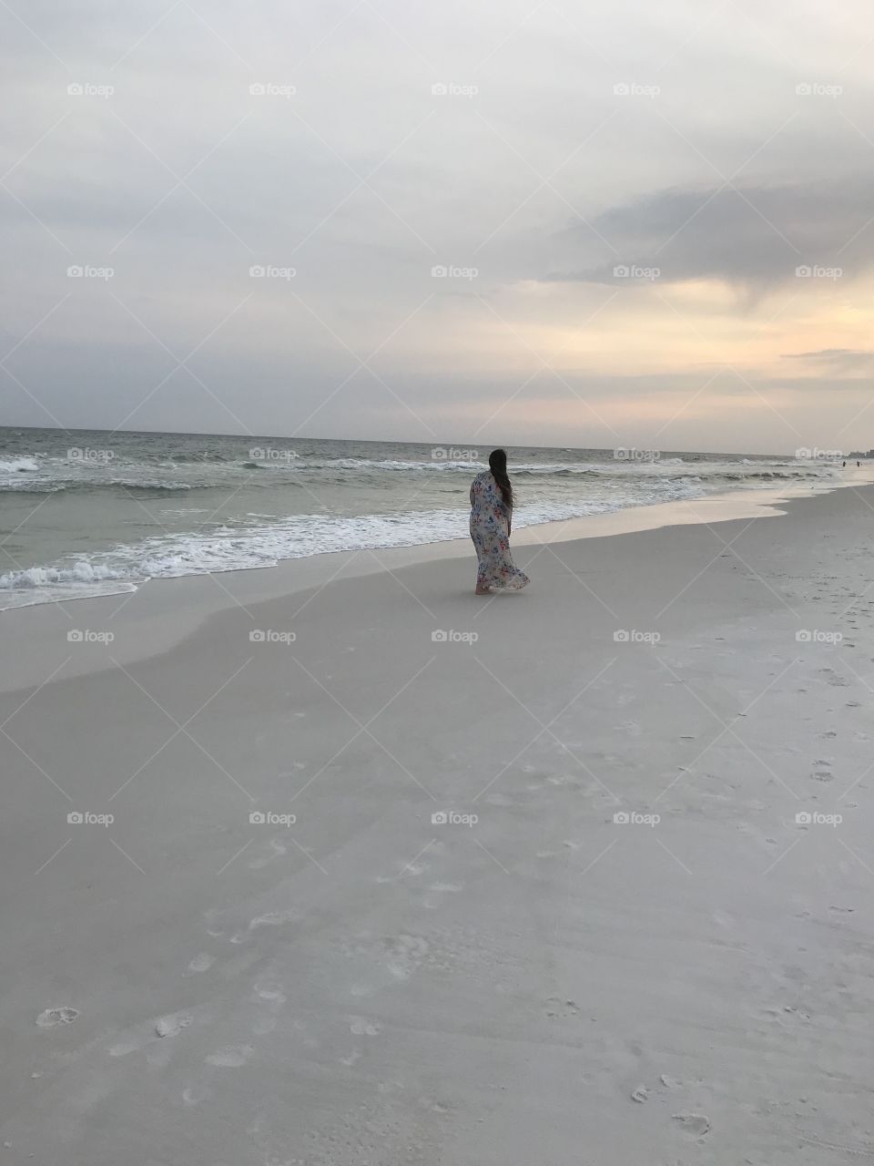 Woman Walking by the ocean 