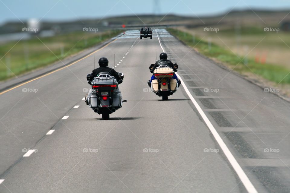 Lets Ride. Traveling down the highway on a pair of Motorcycle's.